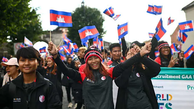 Athletes from Asia participate in the parade during the opening ceremony of the FRS Recruitment GAA World Games 2023 in Derry. Photo by Ramsey Cardy/Sportsfile.