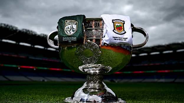 The Sam Maguire Cup pictured at Croke Park alongside Kerry and Mayo jerseys ahead of the All-Ireland SFC Final. Photo by David Fitzgerald/Sportsfile