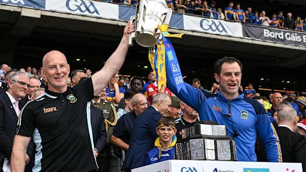 Tipperary Team Physiotherapist Paddy O'Brien and Dr Brendan Murphy lift the Liam MacCarthy Cup after the 2025 GAA Hurling All-Ireland Senior Championship final match between Cork and Tipperary at Croke Park in Dublin. Photo by Ray McManus/Sportsfile