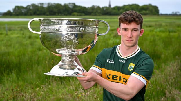 Ruairi Murphy of Kerry poses for a portrait with the Sam Maguire Cup during the launch of the GAA Football All-Ireland Senior Championship National 2024 at Lough Beg in Derry. Photo by Brendan Moran/Sportsfile.