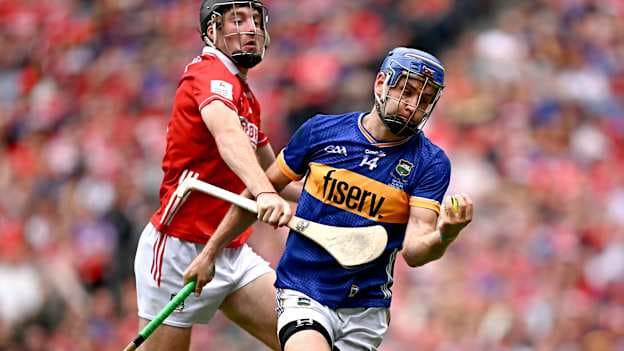 John McGrath of Tipperary in action against Eoin Downey of Cork during the GAA Hurling All-Ireland Senior Championship final match between Cork and Tipperary at Croke Park in Dublin. Photo by Seb Daly/Sportsfile.