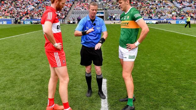 Referee Joe McQuillan with team captains Conor Glass of Derry and David Clifford of Kerry before the 2023 GAA Football All-Ireland Senior Championship Semi-Final match between Derry and Kerry at Croke Park in Dublin. 