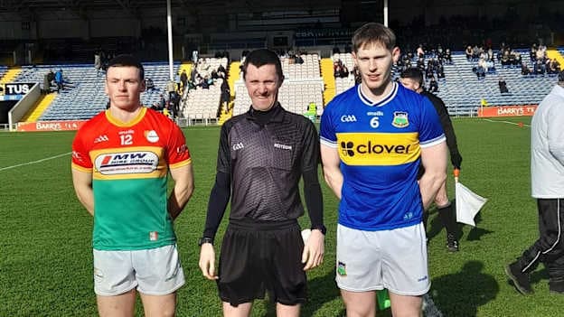 Tipperary captain Paudie Feehan and Carlow captain Mikey Bambrick are pictured with referee James Regan ahead of their Allianz Football League Division 4 clash. 