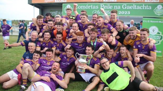 The Wolfe Tones players celebrate after winning the Comórtas Peile na Gaeltachta. 