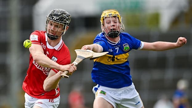 Stephen Murphy of Cork is tackled by Travis McLoughlin of Tipperary during the Electric Ireland All-Ireland Minor Hurling Championship semi-final match between Tipperary and Cork at TUS Gaelic Grounds in Limerick. Photo by Tom Beary/Sportsfile.
