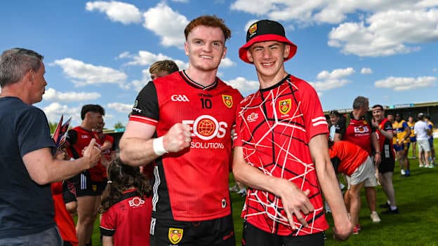 Danny Magill of Down with supporter Callan Magee after the 2025 GAA Football All-Ireland Senior Championship Round 1 match between Clare and Down at Zimmer Biomet Páirc Chíosóg in Ennis, Clare. Photo by Tom Beary/Sportsfile.