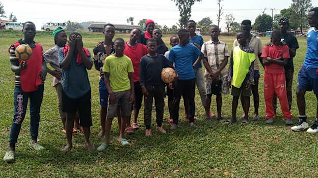 Moses Amanyire, right, pictured with some of the school-children he's coaching. 