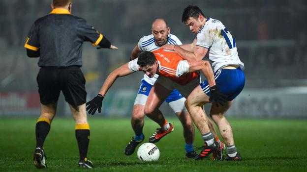 Connaire Mackin of Armagh in action against Gavin Doogan and Barry Kerr, right, of Monaghan, as referee Barry Cassidy looks on, during the Bank of Ireland Dr McKenna Cup Round 3 match between Armagh and Monaghan at the Athletic Grounds in Armagh. 