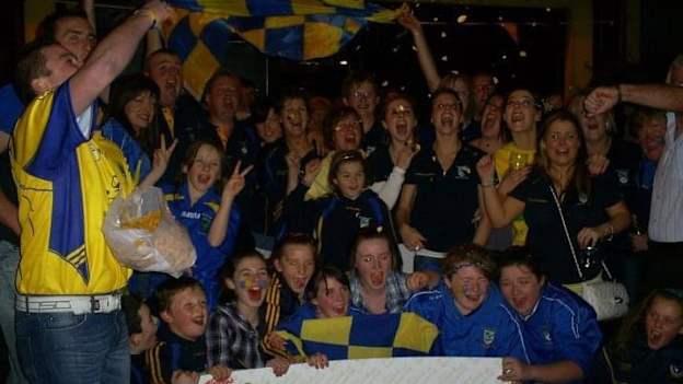 Celebrations break out in the clubhouse when the announcement of their victory is made in 2010