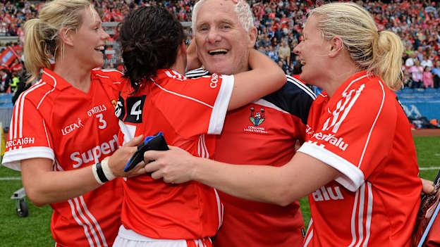 Former Cork manager Eamonn Ryan celebrates with Angela Walsh, left, Geraldine O'Flynn and Deirdre O'Reilly, right, after their victory over Dublin in the 2014 All-Ireland Ladies Senior Football Final. 