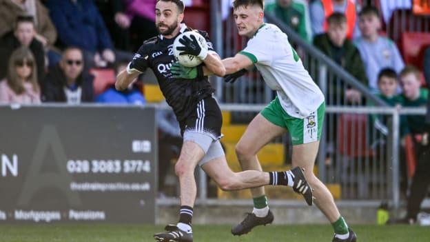 Conor Laverty, Kilcoo, and Ardan McAvoy, Burren in Down SFC Final action.