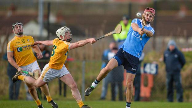 Dublin's Danny Sutcliffe gets a shot off under pressure from Antrim's Donal McKinley in their Allianz Hurling League Division 1B Round 2 match at Corrigan Park