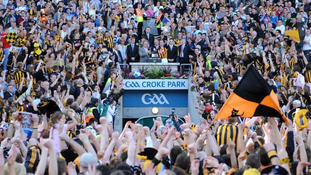 Former GAA President, Nickey Brennan, presents Kilkenny captain James 'Cha' Fitzpatrick with the Liam MacCarthy Cup after the 2008 All-Ireland SHC Final with the new GAA logo emblazoned above the Hogan Stand tunnel. 