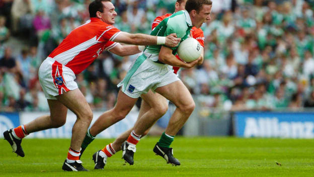 Fermanagh captain, Shane McDermott, charges through the tackles of Armagh's Aidan O'Rourke (left) and Tony McEntee in the 2004 All-Ireland SFC Quarter-Final. 