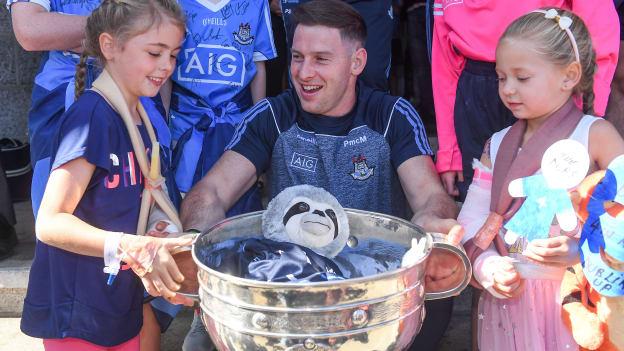 Philly McMahon with Sophie Lawlor, age 8, from Templeogue, left, and Lucy Silke, age 6, from Lucan, during the All-Ireland Senior Football Champions visit to Our Lady's Children's Hospital, Crumlin in Dublin.