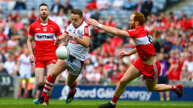 Steven Sherlock, Cork, and Conor Glass, Derry, in All-Ireland SFC Quarter-Final action at Croke Park. Photo by Ray McManus/Sportsfile
