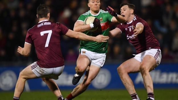 Mayo's Donal Vaughan surrounded by Galway's Johnny Heaney and Tom Flynn during an Allianz Football League clash last March.