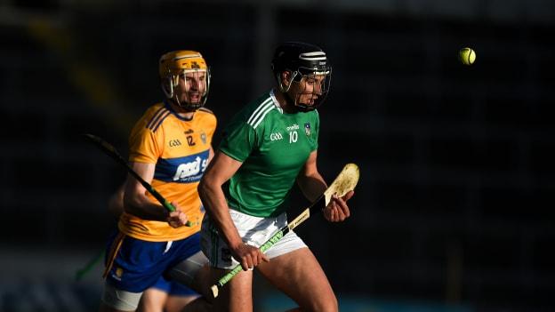 Gearoid Hegarty, Limerick, and David Fitzgerald, Clare, in Munster Senior Hurling Championship action at Semple Stadium.