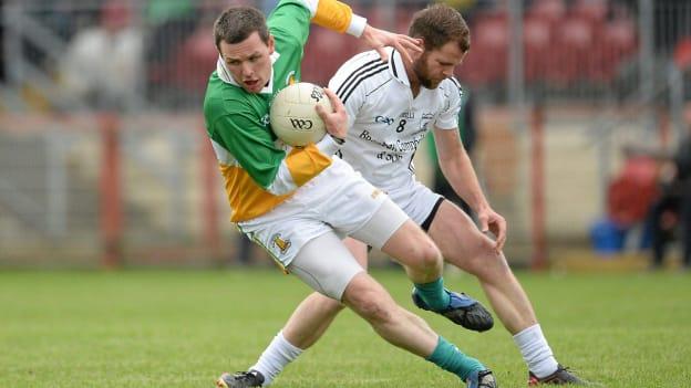 Conor Gormley, Carrickmore St Colmcille's, in action against Stephen McNulty, Clonoe O`Rahilly's CLG in the 2013 Tyrone County Senior Club Football Championship Final.