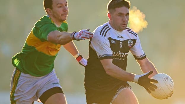 Darryl Branagan of Kilcoo in action against Michael Warnock of Glen during the AIB Ulster GAA Football Senior Club Championship Final match between Glen Watty Graham's of Derry and Kilcoo of Down at the Athletics Grounds in Armagh. 