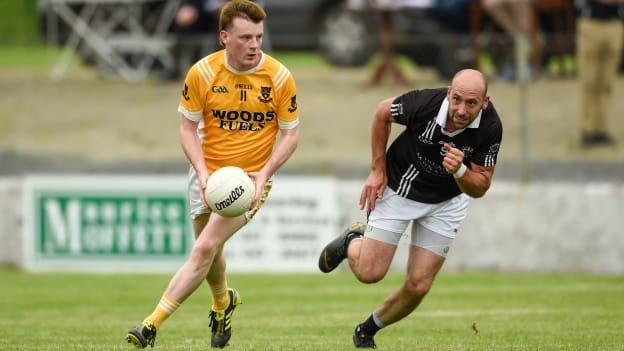 Michael P O'Dowd, Clontibret O'Neills, in Monaghan Senior Football Championship action against Gavin Doogan, Magheracloone.