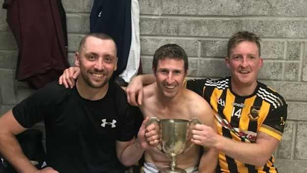 Long-serving trio James Barry, Eoin Shortt, and Pat Shortt celebrate with the Mid-Tipperary Junior A Hurling Cup. 