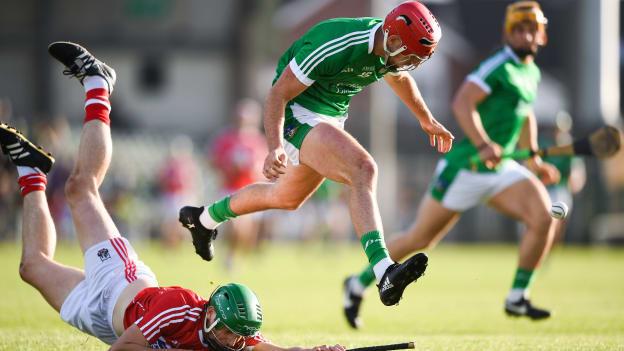 Barry Nash, Limerick, and John Cashman, Cork, during the Bord Gais Energy Munster Under 21 decider.