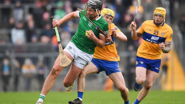 Gearoid Hegarty of Limerick s tackled by Paddy Donnellan of Clare during the 2022 Co-op Superstores Munster Hurling Cup Final match between Limerick and Clare at Cusack Park in Ennis, Clare. 
