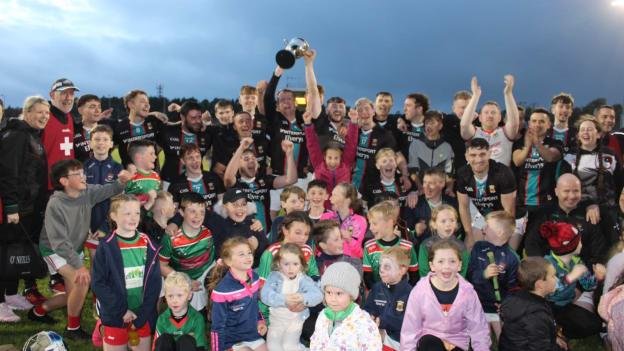 Ballina Stephenites senior hurlers celebrate with their young supporters are victory over Moytura in the 2023 Mayo Junior Hurling A Final. 