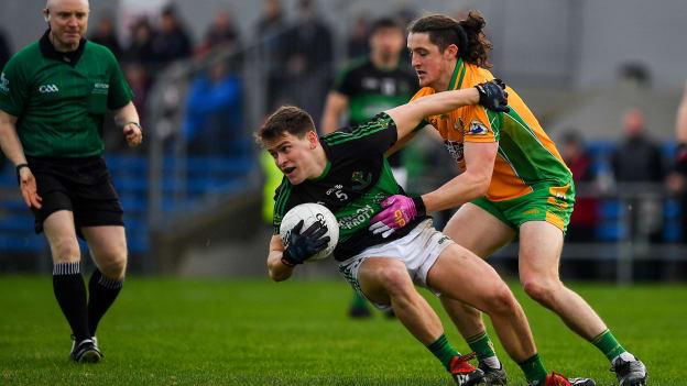 Kevin O'Donovan, Nemo Rangers, and Kieran Molloy, Corofin, during the AIB All Ireland Club Senior Football Championship Semi-Final at Cusack Park.