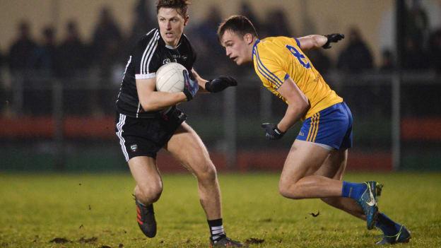 James Clare, Sligo, and Enda Smith, Roscommon, during the Connacht FBD League clash at Kiltoom.