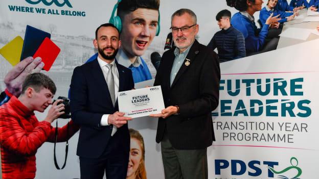 Uachtarán Chumann Lúthchleas Gael Larry McCarthy, right, presents a plaque to Colm Madden of Gort Community School during a GAA PDST Future Leaders promotion event at Croke Park.