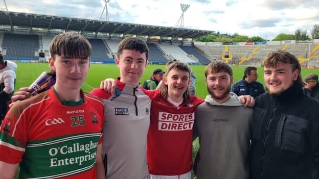 Cork minor footballer Trevor Kiely, centre, congratulated by friends after his team's Electric Ireland Munster minor football championship win over Kerry. 