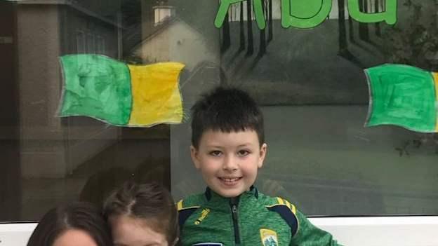 Leona Twiss pictured before last year's All-Ireland Football Final with her two children at Currina NS where she is the School Principal.