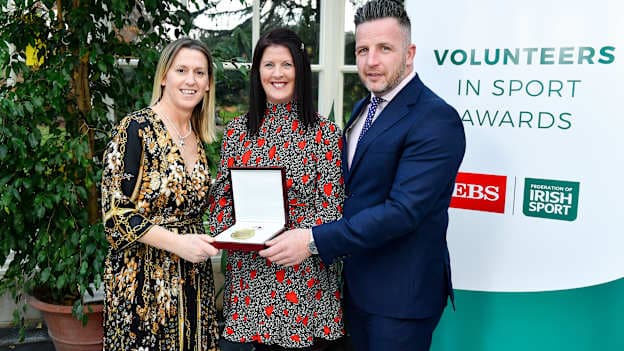 Paula Powell Enright of Armagh Harps Gaelic Football Club, Co. Armagh, is presented with her award by Mary O'Connor, CEO of the Federation of Irish Sport, and Richard Gernon, Regional Manager EBS, during the Volunteers in Sport Awards presented by Federation of Irish Sport with EBS at Farmleigh House in Phoenix Park, Dublin.