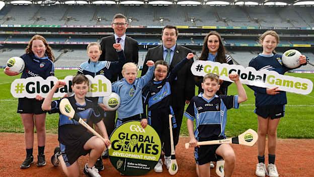 In attendance during the GAA / DFA Global Games Development Fund announcement in March 2022 are Ard Stiúrthóir of the GAA Tom Ryan, centre left, and Minister of State at the Department of Foreign Affairs Colm Brophy TD, centre right, with members of St Jude's GAA Club, from left, Mary Nerney, Tom Moran, Lucy Duffy, Adam Duffy, Jane Moran, Grace Cashin, Jack Fallon and Sarah McDaid, at Croke Park in Dublin.