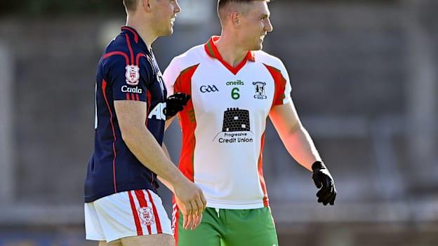 Con O'Callaghan, Cuala, and John Small, Ballymun Kickhams, in Dublin SFC action at Parnell Park.