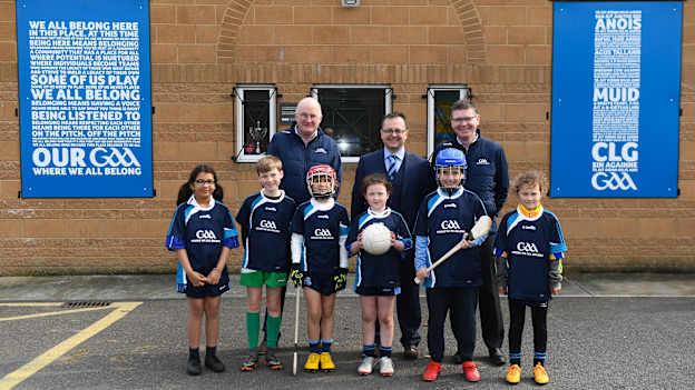 Uachtarán Chumann Lúthchleas Gael John Horan, left, Keith Loughman, Chairman of St Colmcilles GAA Club, and Ard Stiúrthóir of the GAA Tom Ryan, right, with members of St Colmcilles GAA Club, from left, Reva Mehta, age 8, Noah Noone Garland, age 9, Niall O'Donoghue, age 9, Aisling Gillick, age 8, Jack O'Byrne, age 10, and Milena Maza, age 8, at the unveiling of the new GAA manifesto in both Irish and English at St Colmcilles GAA Club in Bettystown, Co Meath. 