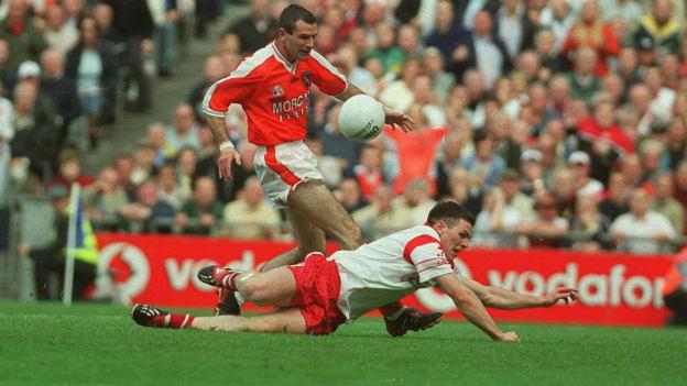 Tyrone's Conor Gormley blocks a late shot from Armagh's Steven McDonnell in the 2003 All-ireland Final. 