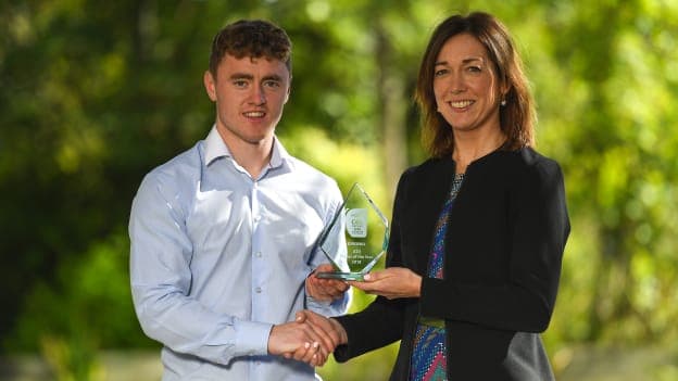 Kildare footballer Jimmy Hyland being presented with his EirGrid U20 GAA Football All-Ireland Championship Player of The Year award by Valerie Hedin, External Communications Manager at EirGrid.