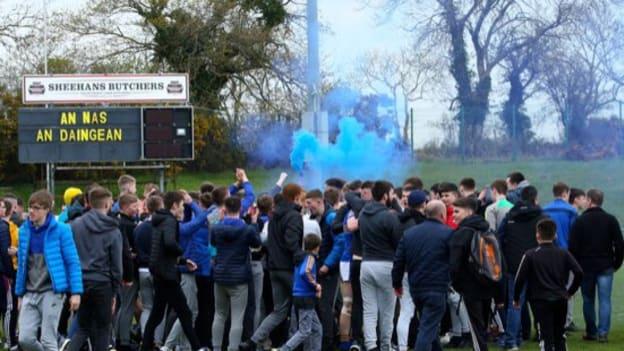 Naas CBS players and supporters celebrate together after their Hogan Cup semi-final victory. 