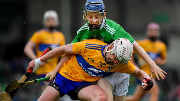 Adam Hogan, Clare, and Patrick O'Donovan, Limerick, during the Electric Ireland Munster Minor Hurling Championship Final at the LIT Gaelic Grounds.