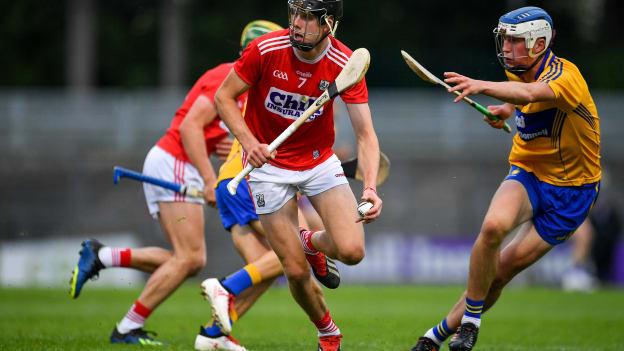 Robert Downey, Cork, and Diarmuid Ryan, Clare, during the Bord Gais Energy Munster Under 20 Semi-Final at Pairc Ui Rinn.