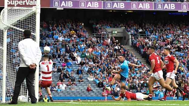 Niall Scully scores Dublin's third goal, despite the efforts of Cork defender Kevin O’Donovan, in the All-Ireland Senior Football Championship Quarter-Final Group 2 Phase 1 at Croke Park on Saturday evening.
