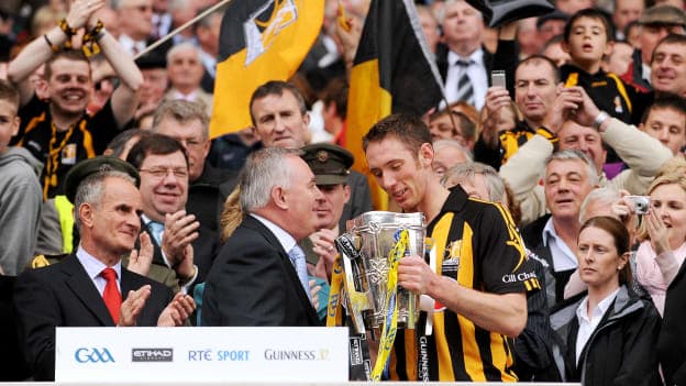 Fennelly receives the Liam MacCarthy Cup from former GAA President Christy Cooney in 2009.