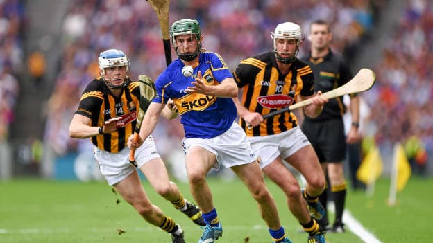Fennelly, right, and Ballyhale clubmate TJ Reid, left, in action against Tipperary's Cathal Barrett in the 2014 All-Ireland Senior Hurling Championship Final replay.