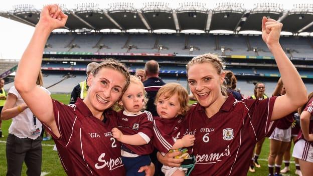 Sinéad Burke, left, and Barbara Hannon of Galway, celebrate with Marlee Burke, aged 1, left, and Miko Finnegan, aged 1, following the TG4 All-Ireland Ladies Senior Football Championship Semi-Final match between Galway and Mayo at Croke Park in Dublin.