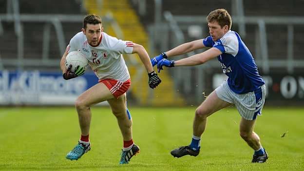 Conor Murray of Lamh Dhearg in action against Robert Maloney Derham of Cavan Gaels during the 2017 AIB Ulster GAA Football Senior Club Championship Quarter-Final.