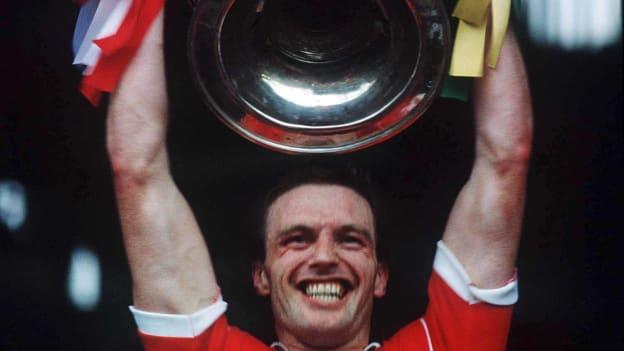 Larry Tompkins lifts the Sam Maguire Cup after captaining Cork to victory over Meath in the 1990 All-Ireland SFC Final. 