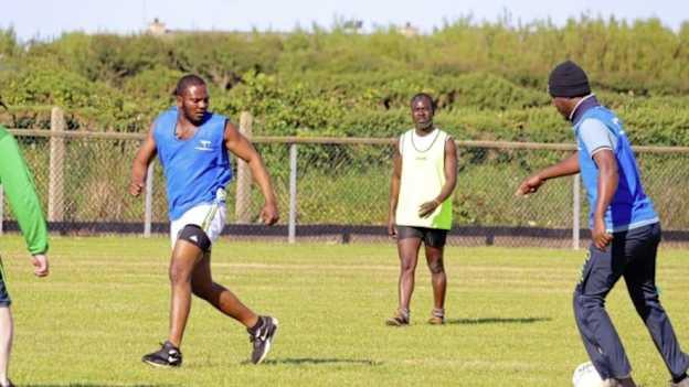 The Ghanaian fisherman pictured learning the skills of Gaelic Football at Ardglass GAC. 